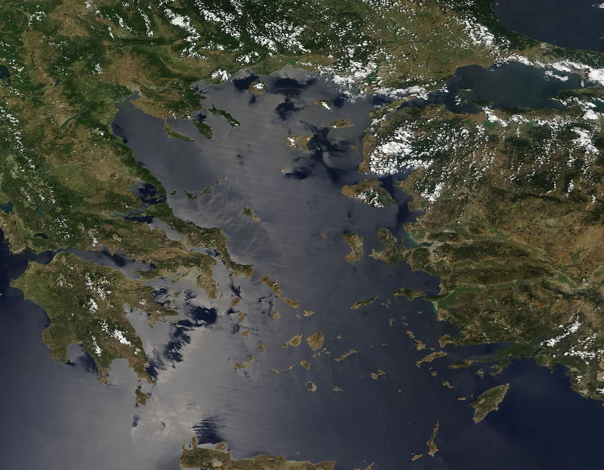 Satellite view of the Aegean Sea in July with wind streaks across the water around the Greek islands